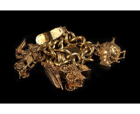 A heavy 9ct gold and yellow metal charm bracelet, the curb link chain bracelet with heart shaped clasp, supporting several 9c