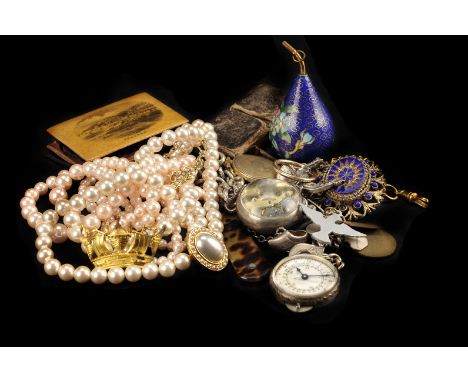 A small group of jewellery and other items, including a collection of silver and white metal charms such as a diving helmet, 