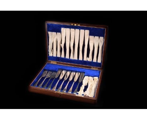 A twelve piece silver plated dinner service by Walker and Hall, Sheffield, comprising table spoons, dessert spoons, two sauce