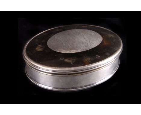 A tortoiseshell patch box, with monogrammed oval white metal paterae, and white metal sides, 10cm L
