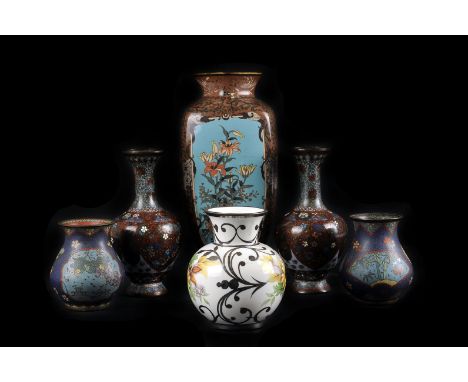 A collection of Meiji period and later cloisonne vases, comprising a pair of baluster vases, a pair of ovoid vases, a censer 