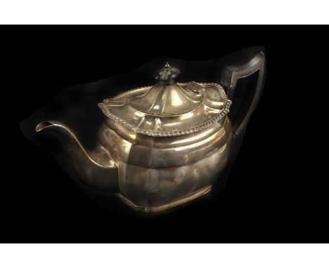 An Edwardian silver teapot by Mappin & Webb, Sheffield 1906, presentation engraved, with gadrooned border, and ebonised finia