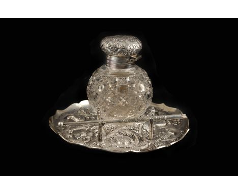 A fine Victorian silver and cut glass inkwell on stand by Charles Boyton, the circular embossed stand with inscription to fro