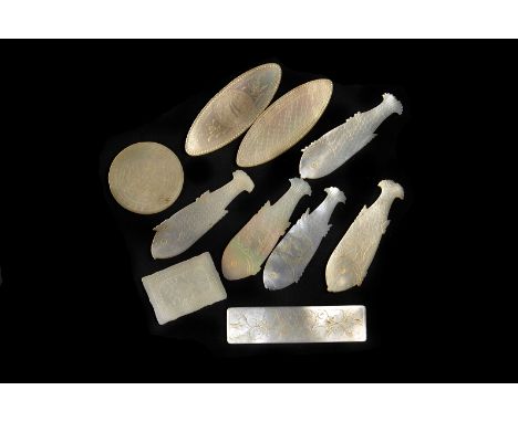 A collection of vintage Chinese mother of pearl gaming counters, presented in a green Italian box, in varying designs, approx