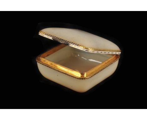 An early 20th century Boucheron gold mounted diamond, enamel and agate box, the cushion shaped agate body with fine gold acan