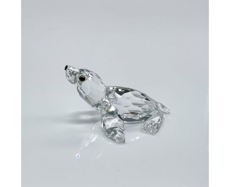 Clear faceted crystal figure of a sea lion with blue/green eyes, black nose. Part of the Aquatic Worlds collection. Swarovski