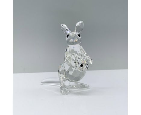 A captivating clear crystal kangaroo, gracefully standing on two legs, while her adorable baby joey peers curiously from her 