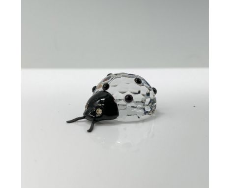 A lovely clear crystal ladybug that is decorated with a black crystal face and black crystal spots. Swarovski backstamp. This