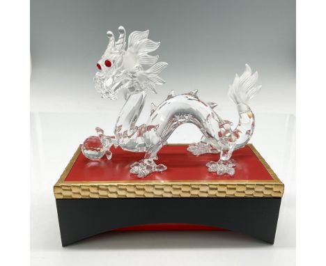 Part of the Fabulous Creatures trilogy, figural is created from clear crystal looking out with his red crystal eyes with foot