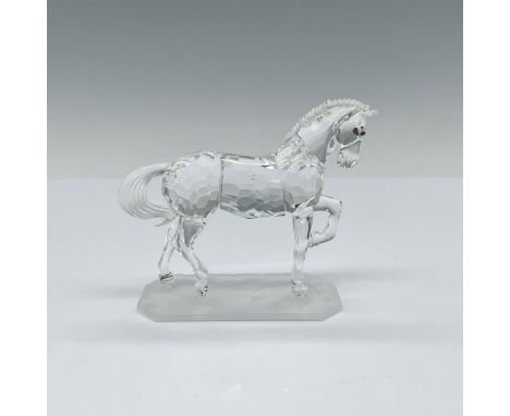 Clear faceted body with a frosted mane and tail. The figurine stands on a frosted base. This item has its original box which 