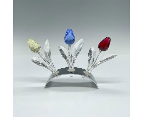 This grouping includes three crystal tulips in red, blue, and yellow along with the display base. These items have their orig