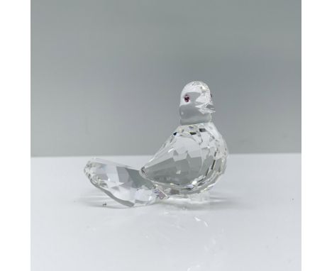 A stunning clear crystal figurine of a dove in a seated position decorated with pink crystal eyes. Swarovski backstamp. This 