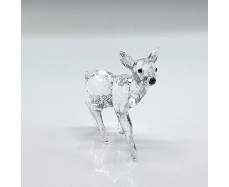 Clear faceted crystal figure of a little fawn; black eyes and nose. Swarovski etched backstamp. This item has its original bo