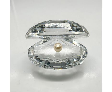 Part of the Aquatic Worlds theme group, this clear faceted crystal reflects light brilliantly and is enhanced by the pearl pr