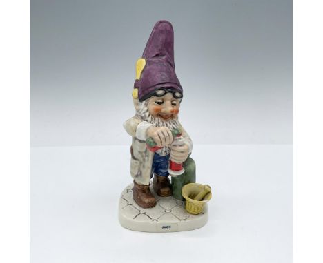 Hand painted in both glossy and matte finish depicting a happy elf mixing medicine, wearing a tall purple elf cap with a spoo
