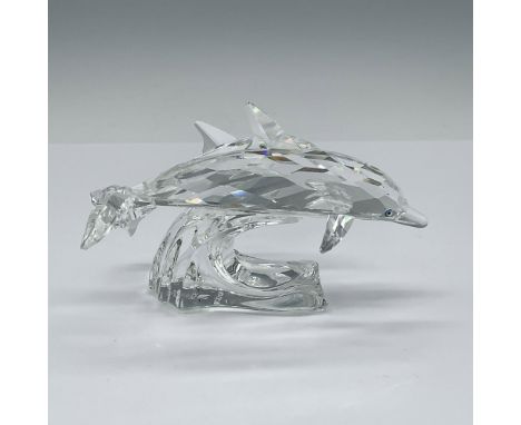 Faceted clear crystal pair of dolphins, mother and child, with radiant eyes riding a clear crystal wave. Swarovski etched bac
