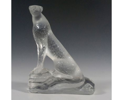A frosted sculpture of a seated cheetah on clear rock like base. Lalique France etched backstamp. Issued: c. 1980Dimensions: 