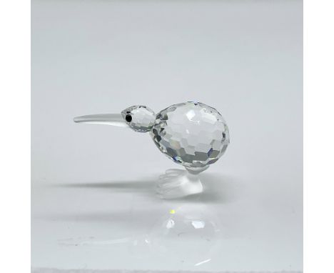 Sparkling faceted crystal figure of a standing kiwi bird with black eyes, frosted beak and feet. Swarovski mark. This item ha