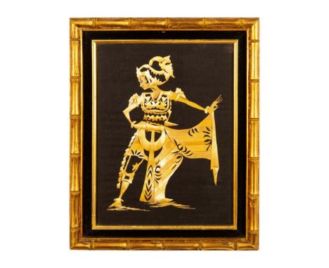 Decorative Indonesian wall art made with delicately cut dried palm leaves assembled to represent a dancer. Housed in a gilded