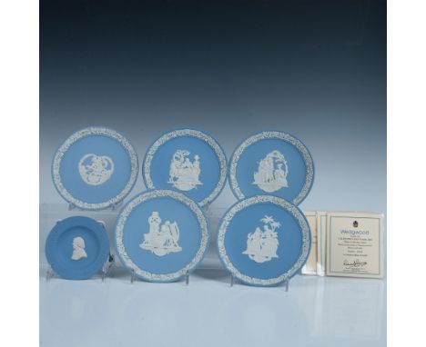 These Valentine's plates, measuring 6.25" in dia., feature a pale blue ground adorned with white raised relief figures and bo