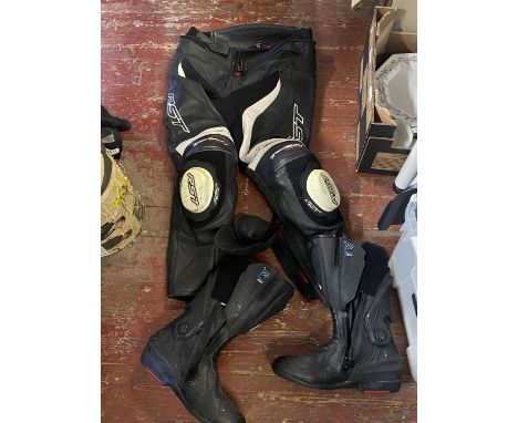 A pair of RST motorbike trousers size 30 and a pair of RST motorbike boots size 42