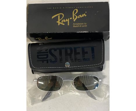 A pair of Rayban sunglasses, as new with box and case