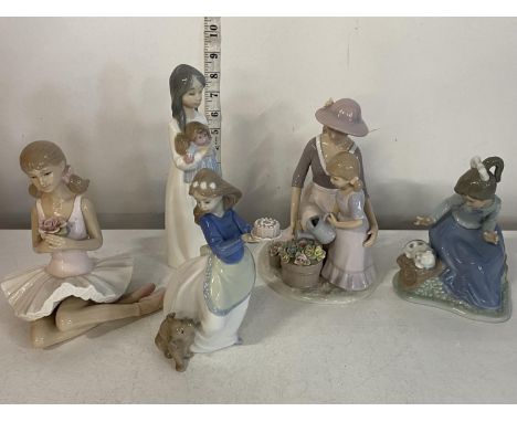A selection of assorted Nao and Leonardo figurines, shipping unavailable
