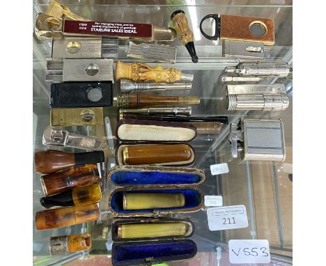 A selection of smokers items including cigar cutters and cheroot holders etc