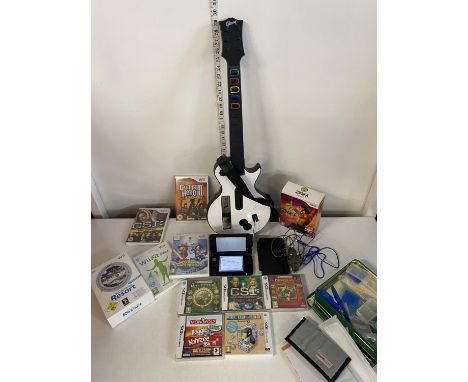 A selection of assorted Wii games and DS games and a DS3 XL console in working order, shipping unavailable