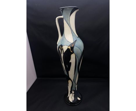 A Moorcroft slender handled ewer Pole to Pole 'Penguins' by Kerry Goodwin (crazing to the glaze) H32cm