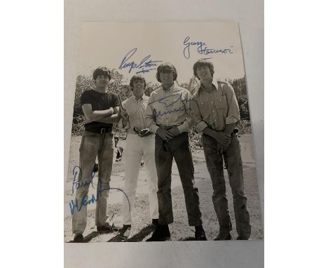 A signed 10 x 8 photo of The Beatles - signed when filming the movie 'Help' in Bahamas. Originally obtained by a member of th