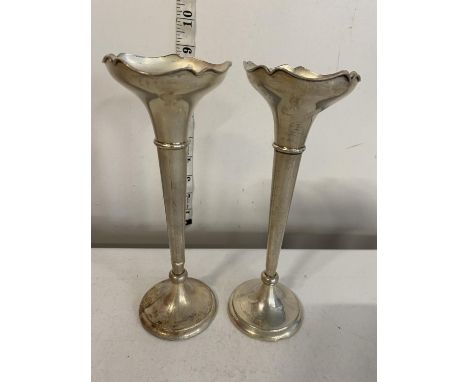 A pair of hallmarked silver trumpet vases with loaded bases gross weight 264g 
