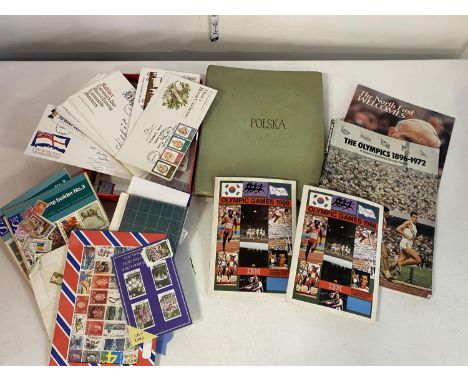 A selection of assorted stamp albums and other ephemera including Olympics