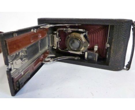 A vintage Kodak camera entitled The Carbine in original leather case