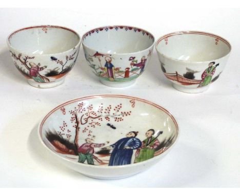 A group of New Hall tea wares decorated with the boy and the bug pattern, comprising three tea bowls and one saucer