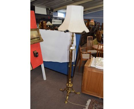 A large brass standard lamp in the Arts and Crafts style - 170 cm high including shade
