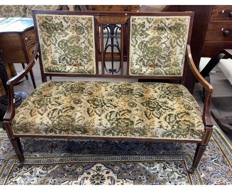 An Edwardian mahogany framed cottage sofa with floral upholstery, 116cm wide