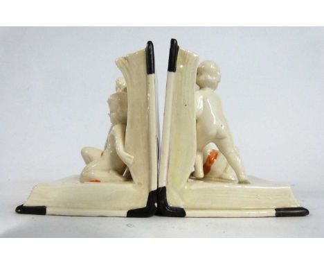 A pair of ceramic Art Deco book ends