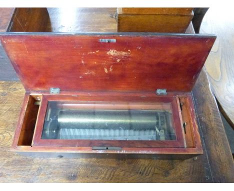 A late 19th/early 20th Century music box with 27cm brass cylinder set into a hardwood and inlaid case, no makers marks appare