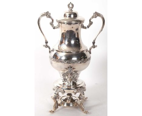 A large samovar silver plated tea urn, in twin handled trophy form with floral banded body, ornate tap on an integral scroll 