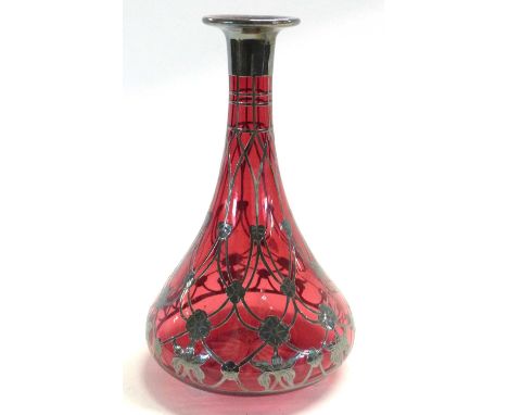 A continental ruby coloured glass decanter with Art Nouveau metal overlay in WMF style with metal collar, 24cm high