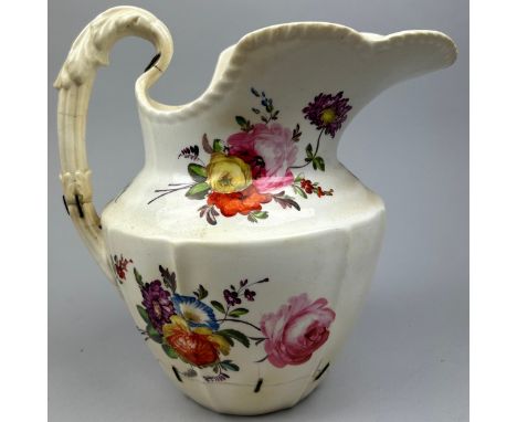 A LARGE FLORAL CERAMIC JUG
