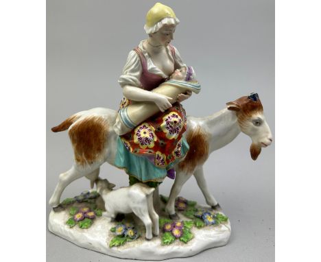 A CHELSEA PORCELAIN CERAMIC GROUP OF A LADY WITH A GOAT, with gold anchor mark. 