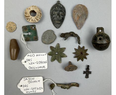 A COLLECTION OF METAL DETECTING ANTIQUITY FINDS, to include Saxon animal broach, neolithic flint, medieval mounts, crotal bel