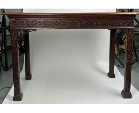 A GEORGE III SERVING TABLE CIRCA 1780 IN MANNER OF THOMAS CHIPPENDALE, Chinese gothic design with later applied top above a c