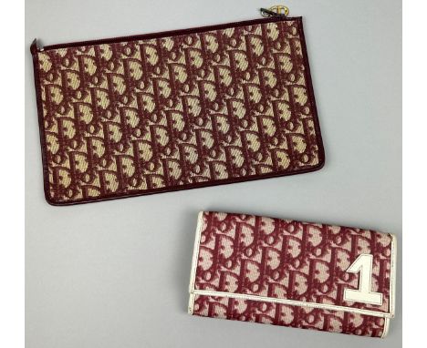 A CHRISTIAN DIOR CLUTCH BAG AND PURSE, both with Dior red and beige monogram (2)Stamped within. Zip and button clasps fully f