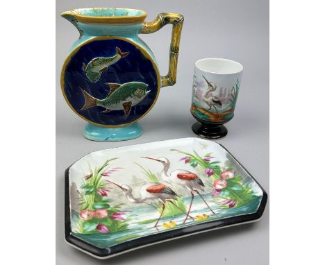 A JOSEPH HOLDCROFT AESTHETIC MOVEMENT CERAMIC JUG, the flattened circular sides in relief with fish in blue waters with simul