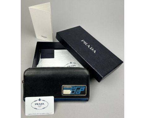 A PRADA WALLET 2019 SAFFRANO PATCH NERO AND AZZURRO, zipped with inner compartments. With box and certificate of authenticity