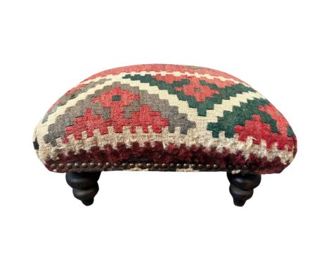 A Victorian Turkish Kelim covered stool, height 30cm, width 45cm, depth 45cm.