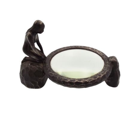 An Art Deco Bausche Lomb nude girl metal magnifying glass, inscribed Rochester, N Y. Des Pat 81359', height 9cm. width 14.5cm
